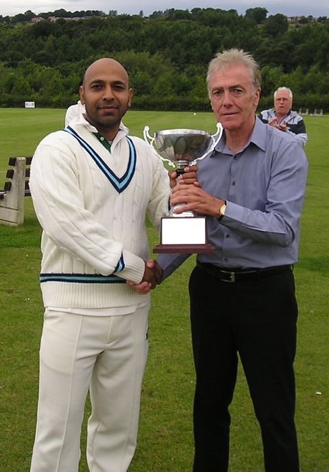 Mustajab Hussain Posing With the League Cup